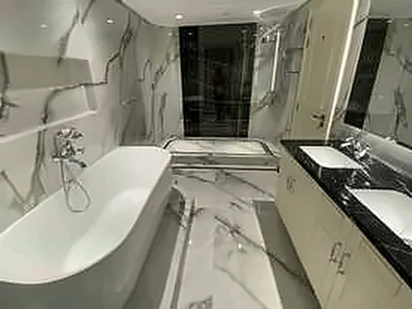 Marble bathroom with a freestanding bath and double vanity