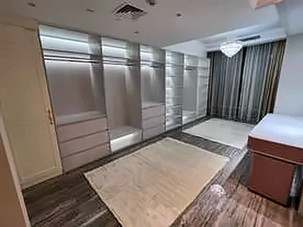 Walk-in wardrobe with built-in cabinetry