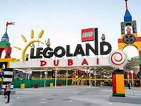 Legoland Dubai entrance sign with colourful brick towers