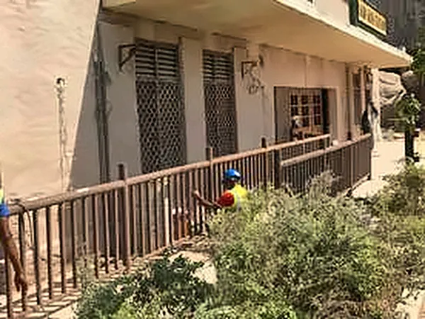 Themed building facade with timber railing and planting