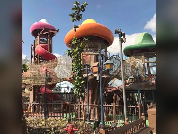 Themed treehouse towers with mushroom-shaped roofs