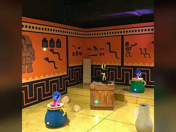 Ancient-Egyptian-style themed room with orange walls and a golden floor