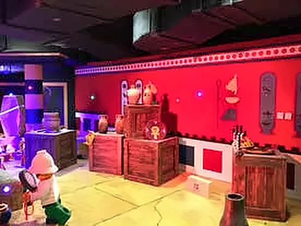 Red and purple lit themed room with props