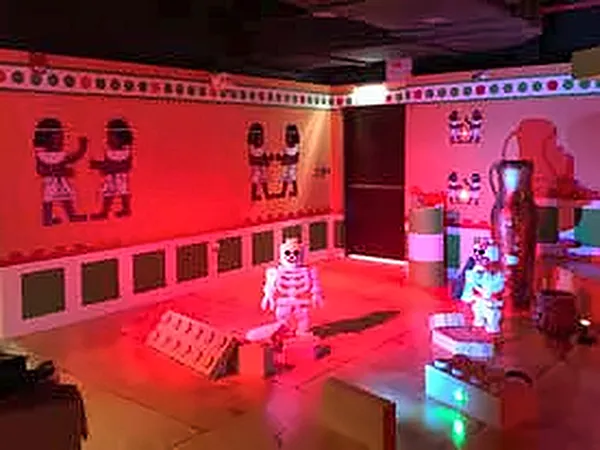 Red-lit themed room with a character figure