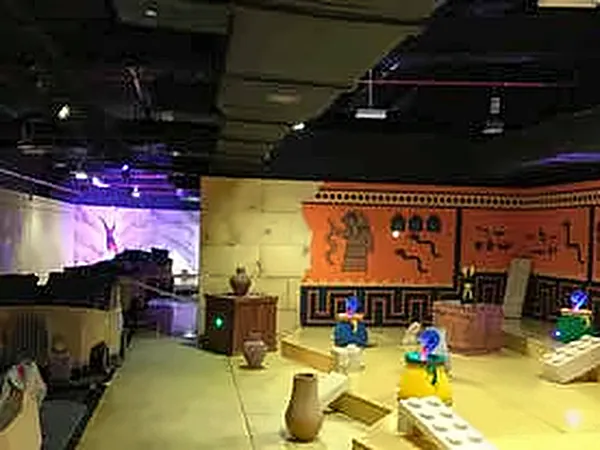 Wide view of a themed interior with sand-coloured set pieces