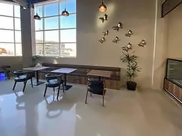 Seating area with large windows and pendant lights