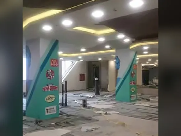 Fit-out in progress with spotlights and teal feature panels